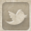 Twitter logo, sepia tone.